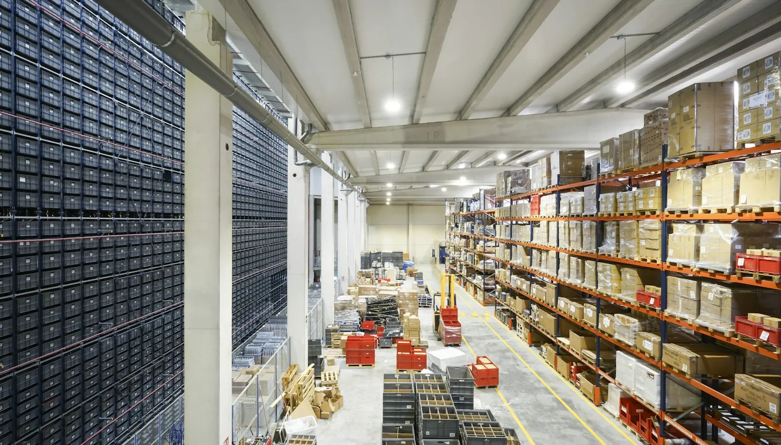Large warehouse with pallets of boxed finished goods awaiting shipment.
