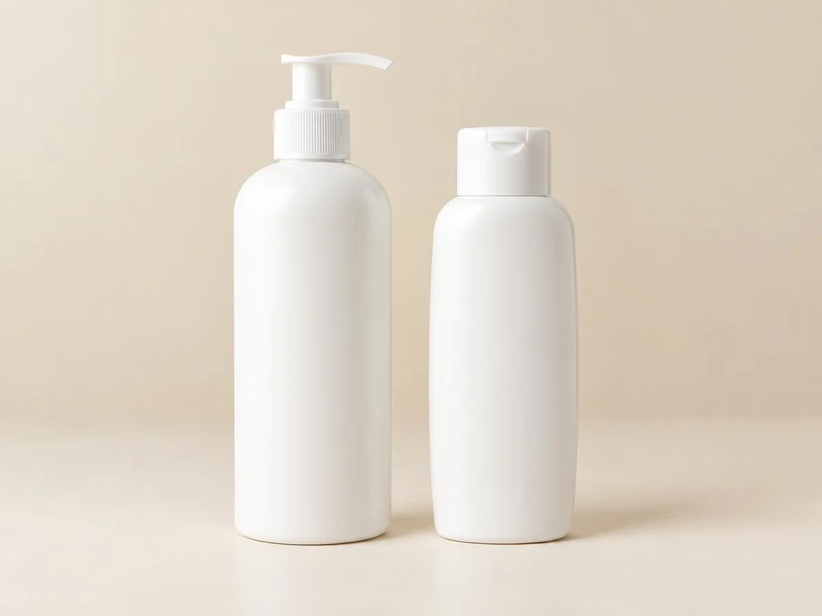 Unbranded white shampoo pump bottle and conditioner flip-cap bottle